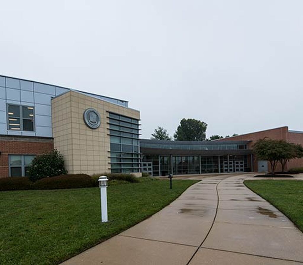 Archbishop Spaulding High School with upholstered fixed theater seating ...